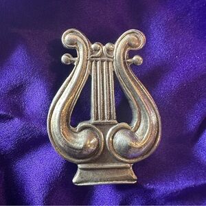 Vintage silver toned pendant. No stamp but it did polish up just now. Unique